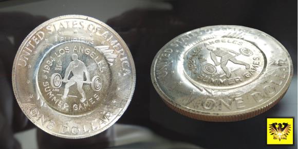 Zu sehen ist die Eisenhower One Dollar Münze aus den USA, mit Gegenstempelung der Summer Games 1984 in Los Angeles.